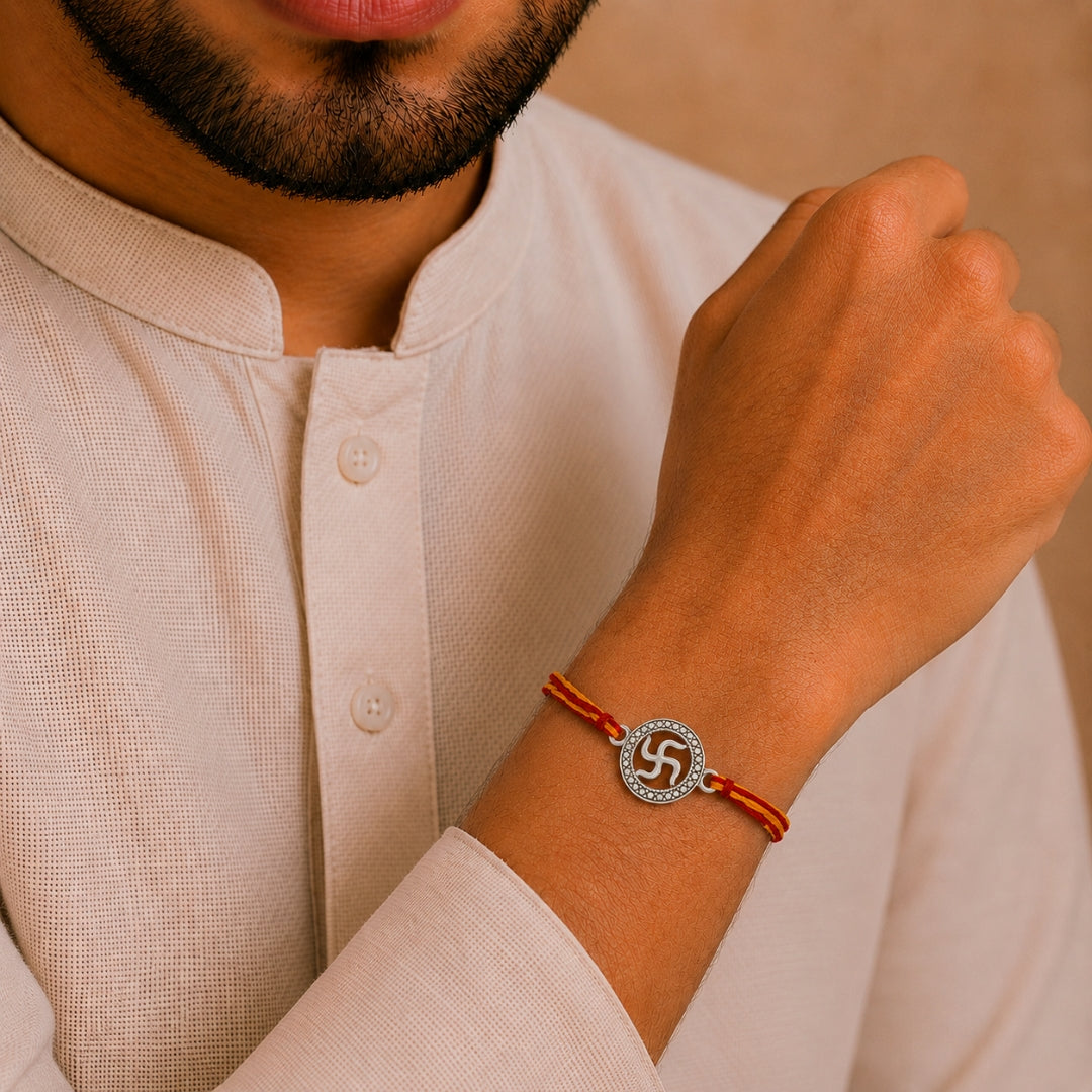 Brother wearing Silver Swastik Rakhi by Silviya – 925 silver spiritual rakhi for Raksha Bandhan.