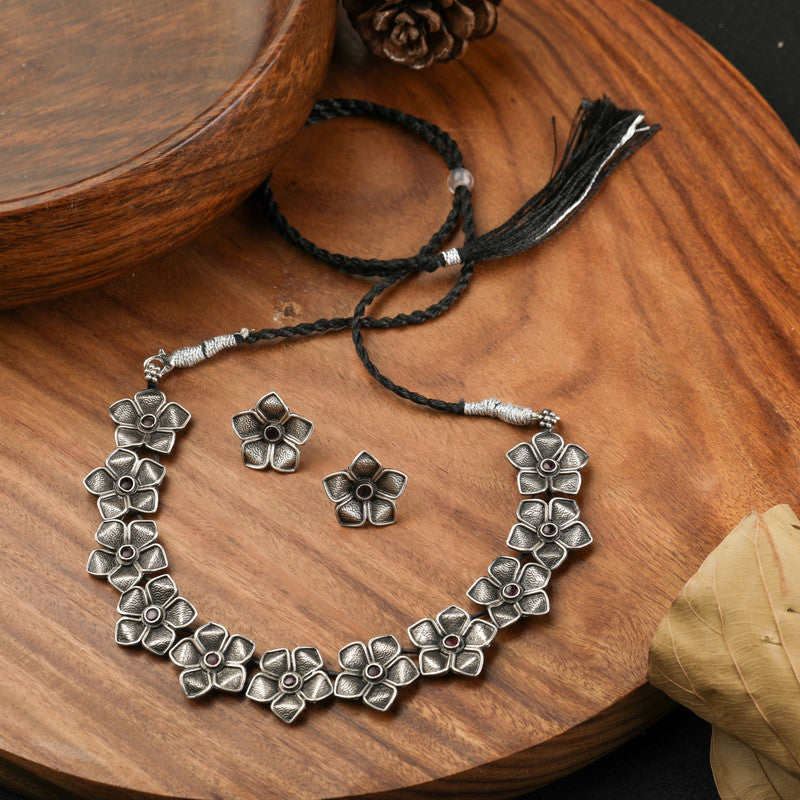 Oxidised Silver Petal Necklace displayed on festive prop – perfect Raksha Bandhan and Bhai Dooj gift