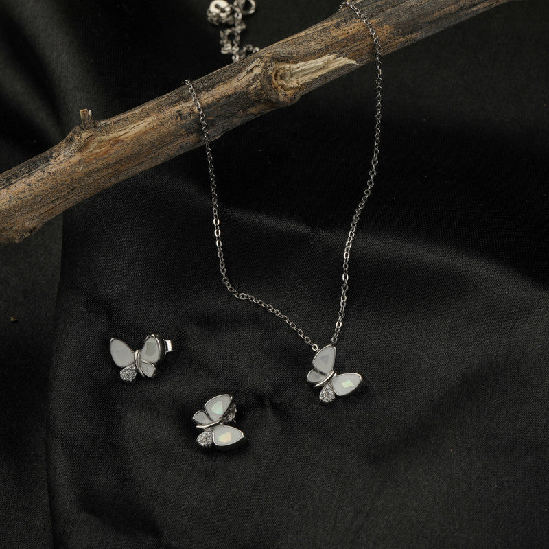 925 silver butterfly pendant and earrings displayed with props – unique silver accessory set