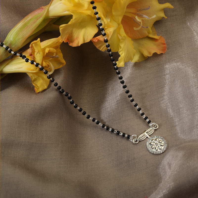 925 Silver Finery Mangalsutra displayed with flowers – perfect silver mangalsutra gift for wife or anniversary