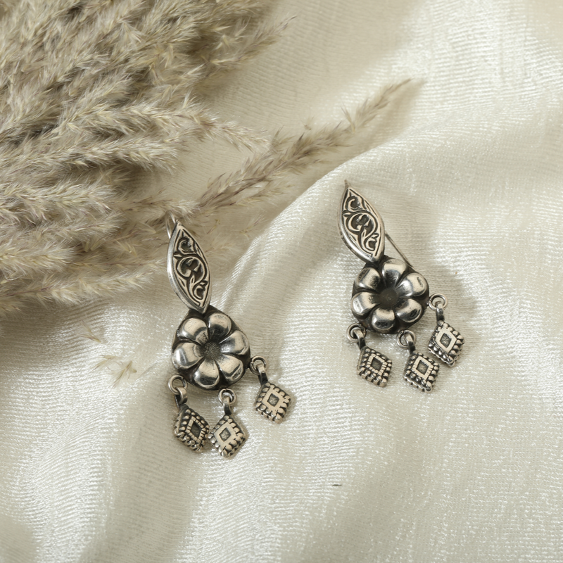 925 Silver Floral Teardrop Earrings displayed as prop image on festive background – trendy silver earrings with fine detailing.