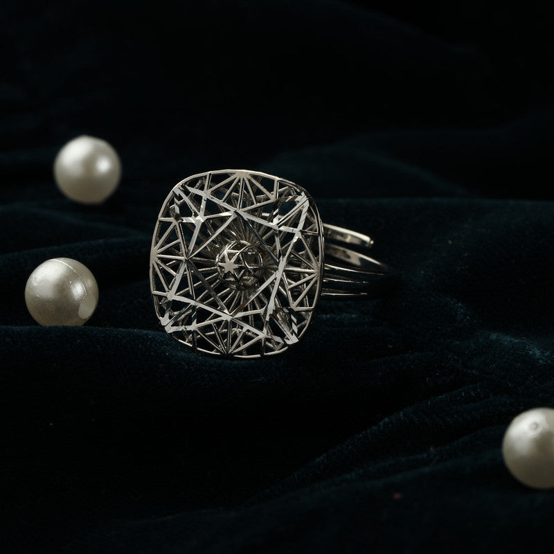925 silver geometric spinner ring displayed with props – modern silver accessory
