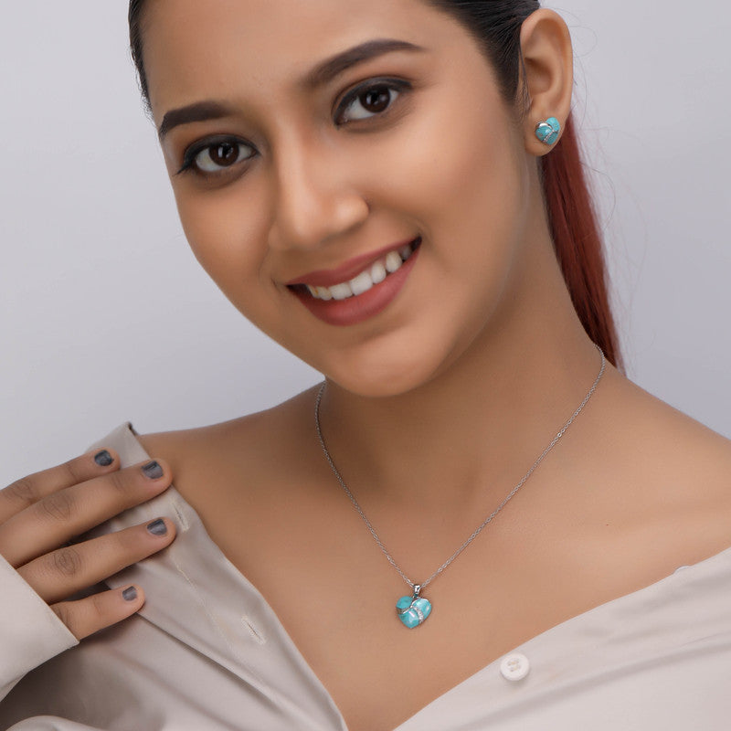Woman wearing 925 silver heart pendant and earrings – stylish ethnic jewelry set