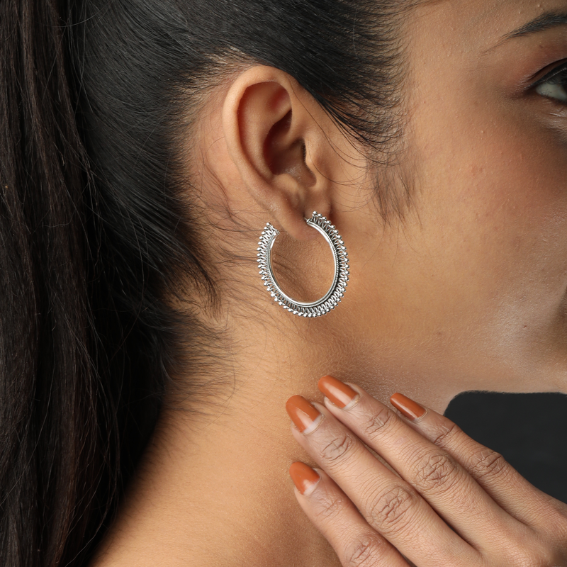 Woman wearing 925 Silver Hollow Hoop Earrings – modern and stylish everyday look