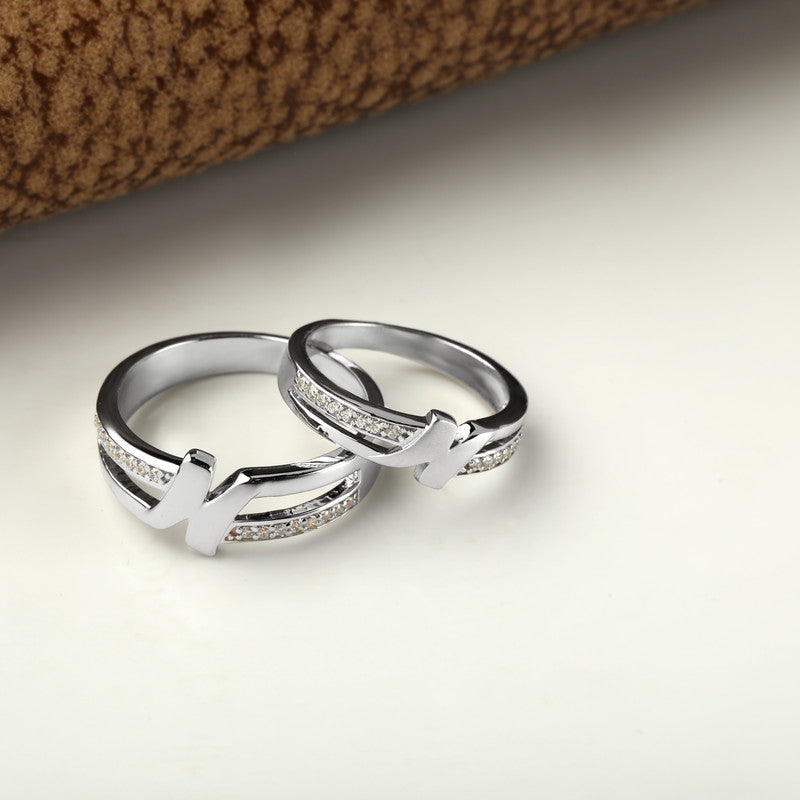 925 silver initial couple rings displayed with props – romantic silver accessory set