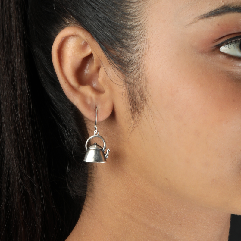Woman wearing 925 Silver Kettle Earrings – quirky and stylish look