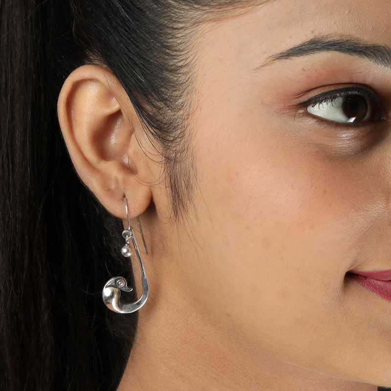 Woman wearing 925 Silver Parrot Earrings – vibrant and stylish look