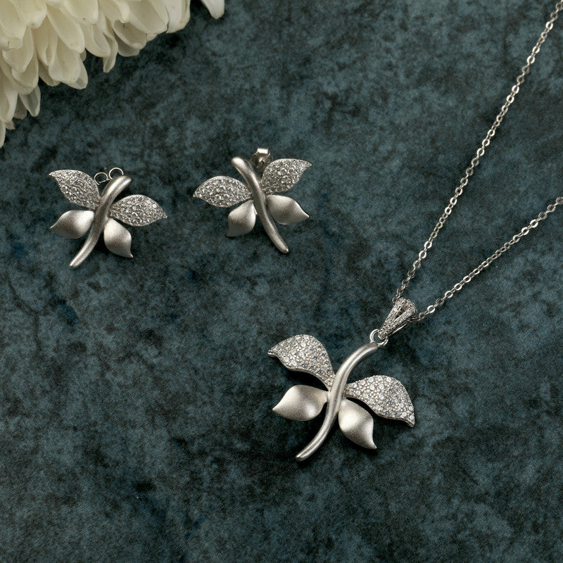 925 silver petal pendant and earrings displayed with props – floral silver accessory set