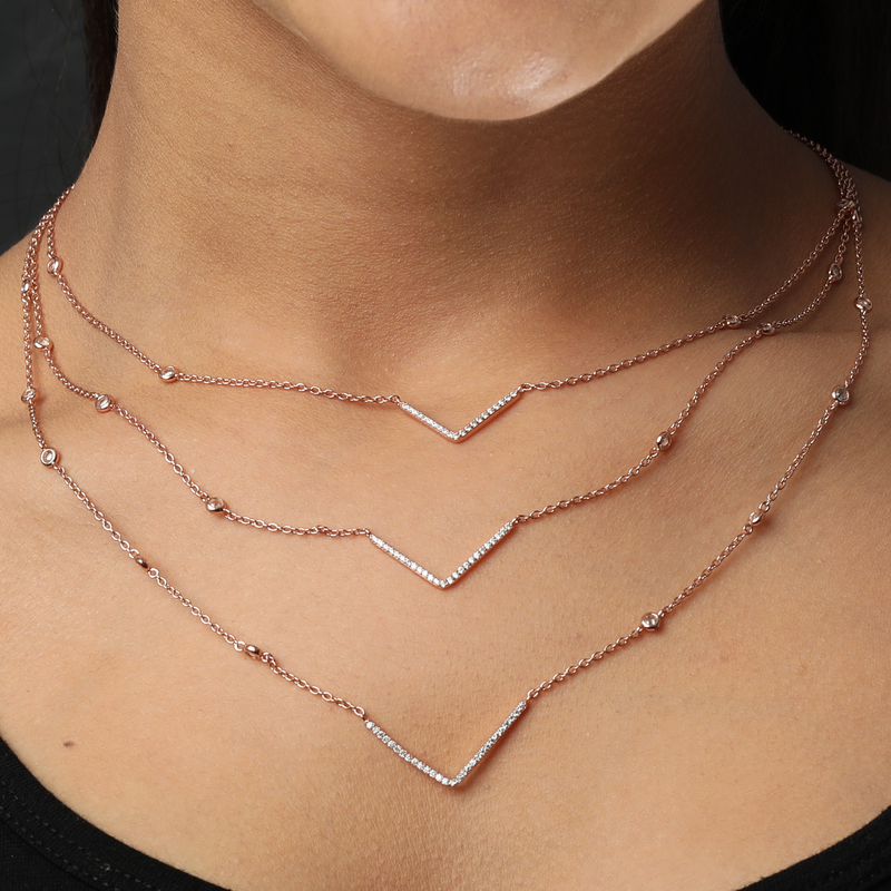Model wearing 925 Silver Rose Gold Charm Necklace – graceful and lightweight sterling silver jewellery for women.
