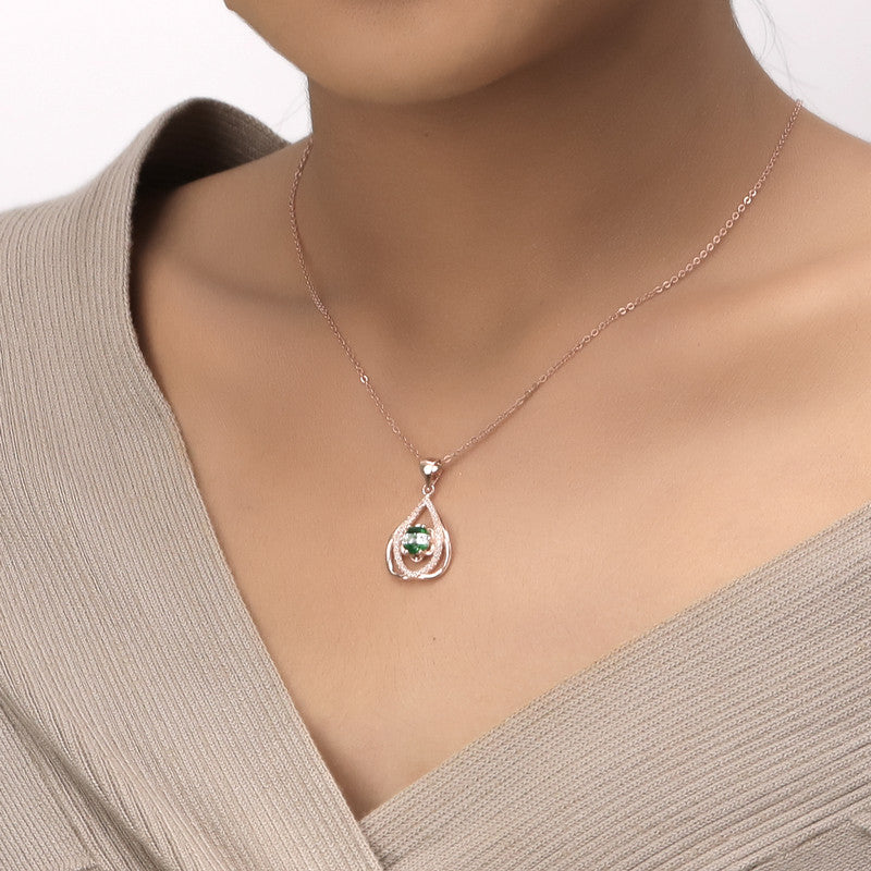 Model wearing 925 Silver Rose Gold Emerald Pendant Necklace – stylish festive accessory for women
