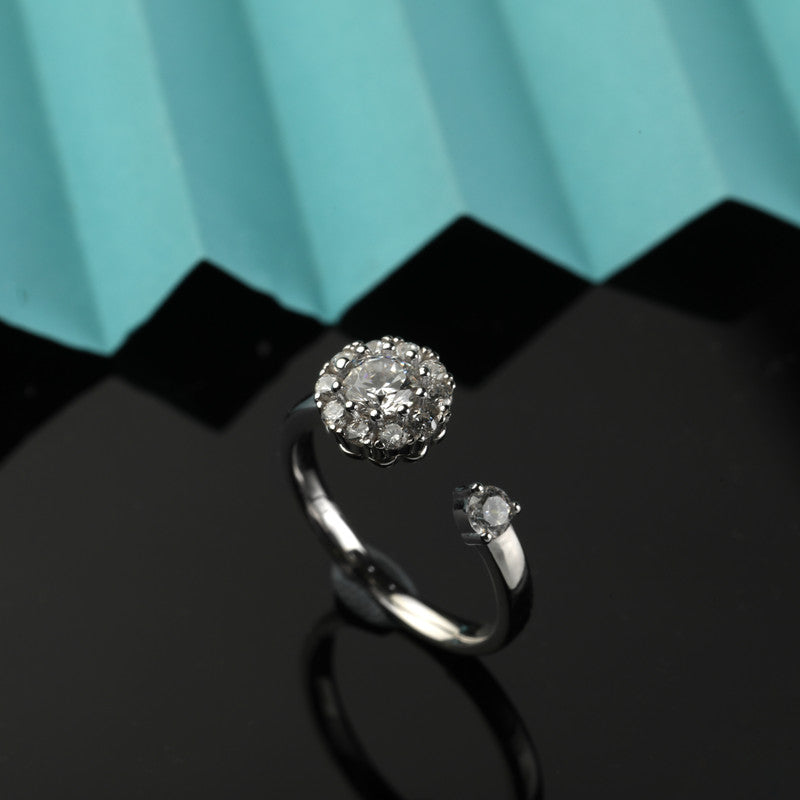 925 silver spinning floral ring displayed with props – floral silver accessory