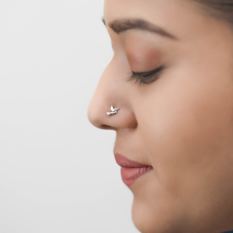 Woman wearing 925 Sterling Silver Bird Nose Pin styled on nose