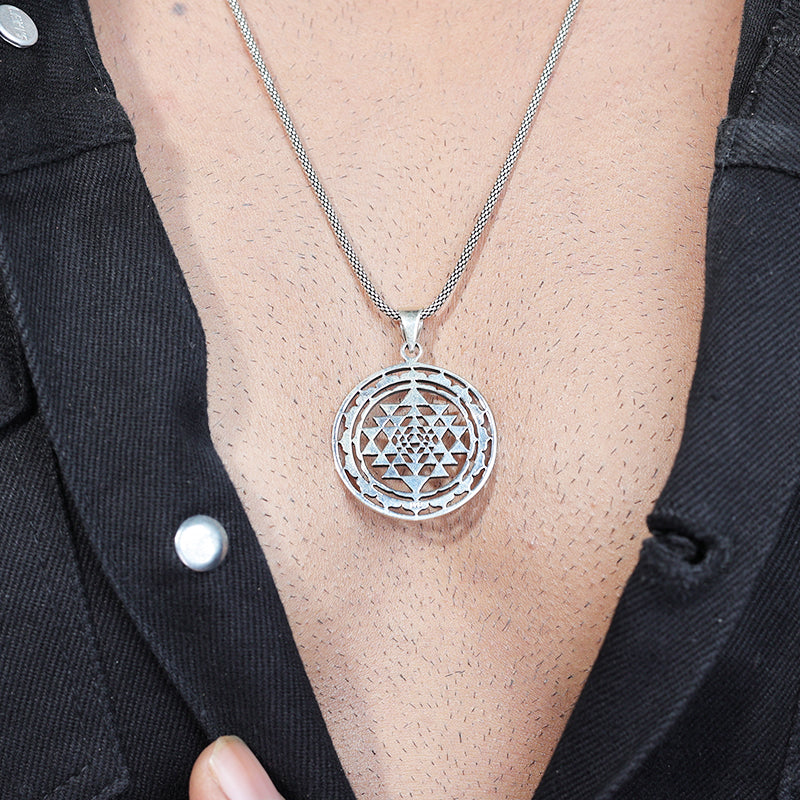 Man wearing 925 Silver Chakra Pendant Necklace with Traditional Hindu Design