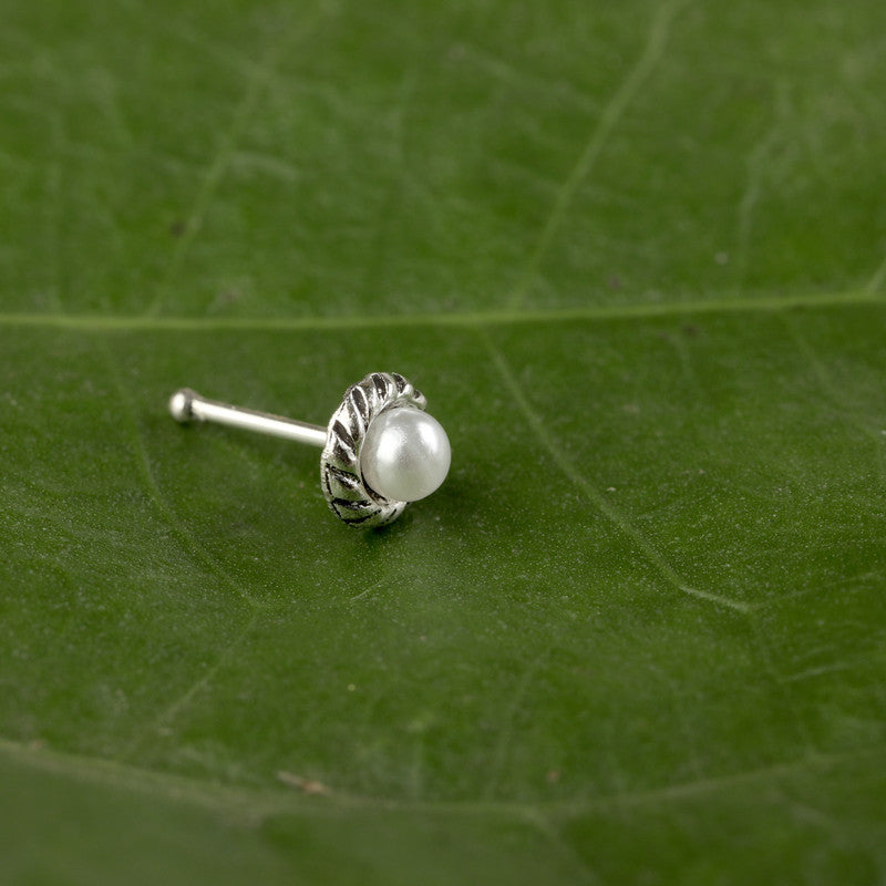 Close-up of 925 Sterling Silver Dimcy Nose Pin placed on green surface
