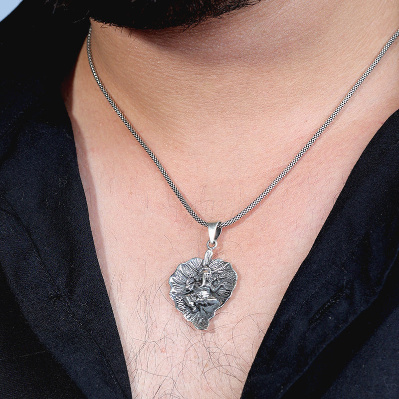 Man wearing 925 Silver Ganesha Pendant Necklace with Spiritual Hindu God Design
