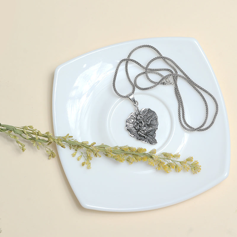Men’s 925 Sterling Silver Ganesha Pendant with Detailed Lord Ganesha Design displayed on surface
