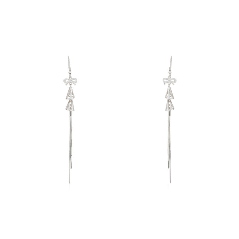 925 silver bow and bell dangle earrings for women – elegant festive jewellery for Diwali, Navratri, and wedding celebrations.