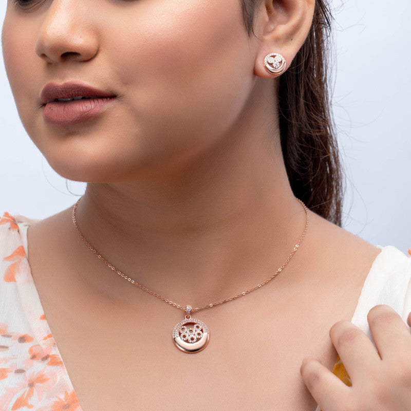 Woman wearing a crystal ring pendant in silver, adding shine to her festive celebration look.