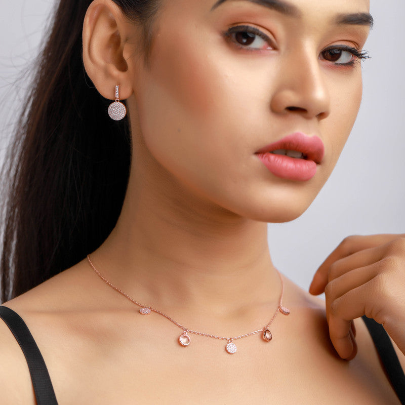 Stylish woman wearing a rose gold disc silver necklace, ideal for festive occasions and party looks.