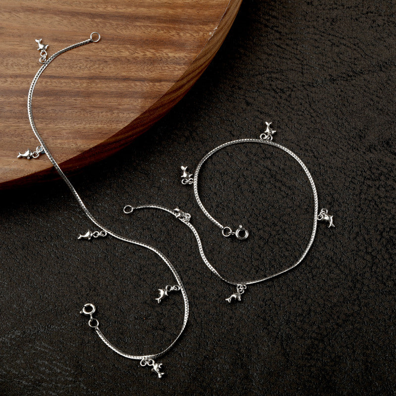 Shimmering 925 silver anklet with fish charm, glowing accessory for Karwa Chauth and Diwali wear.