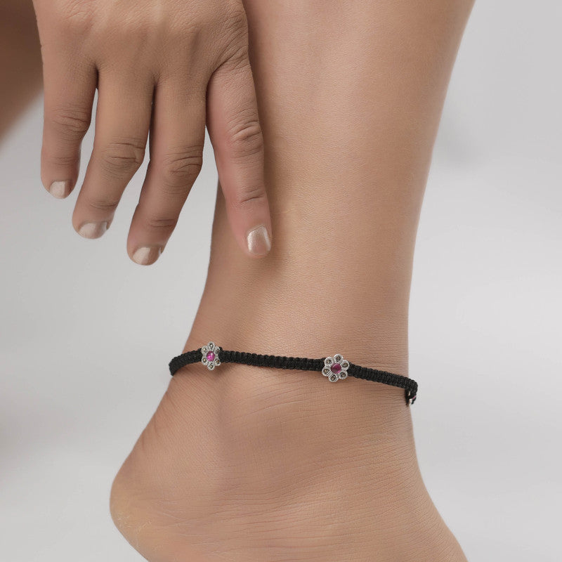 Woman styled with silver flower anklet, pretty jewellery for Navratri wear and festive looks.