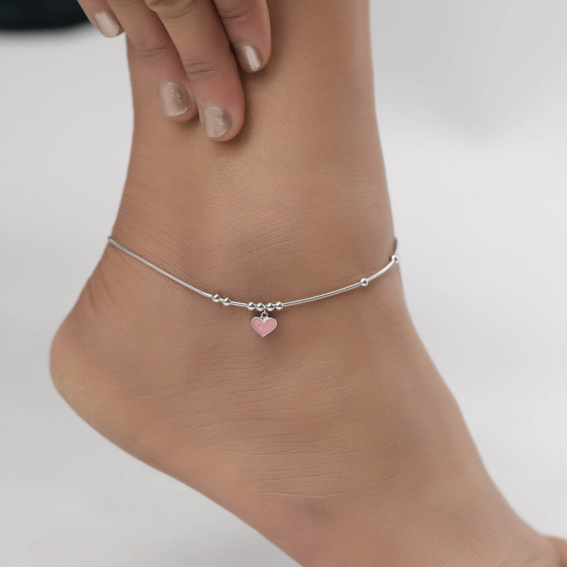 Woman styled in silver heart anklet, pretty jewellery for Navratri wear and festive outfits.