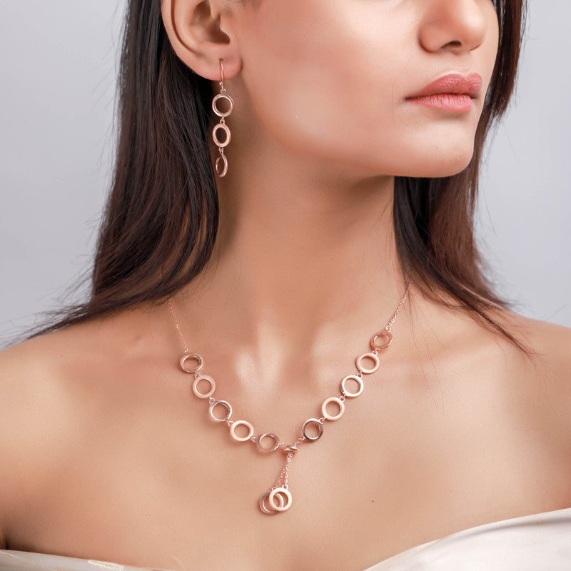 Woman wearing a silver link ring necklace, adding a graceful touch to her festive look.
