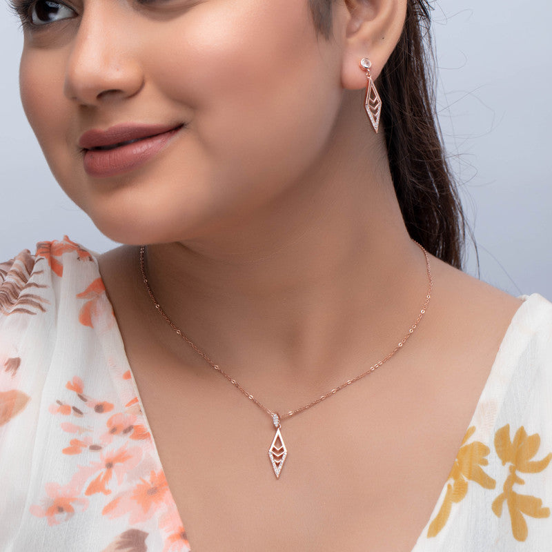 Woman wearing silver rhombus pendant set, elegant jewellery for festivals and parties.