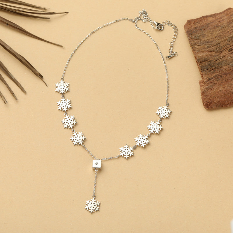 Close-up of sparkling snowflake pendant on silver chain — premium jewellery gift for Diwali, Eid, and anniversaries.
