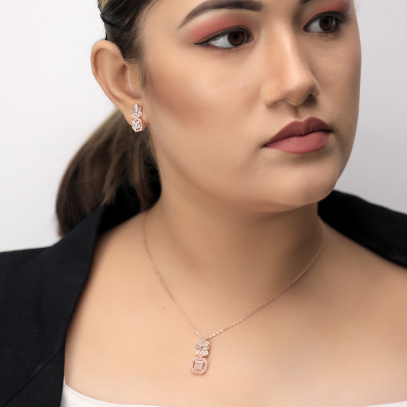 Woman wearing silver sparkling oval queen pendant, stylish accessory for festivals and parties.