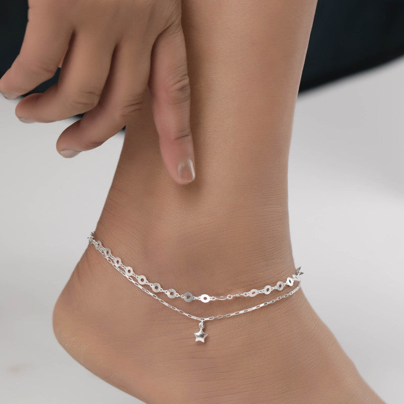 Woman styled in star charm layered anklet, chic jewellery for Navratri wear and festive outfits.