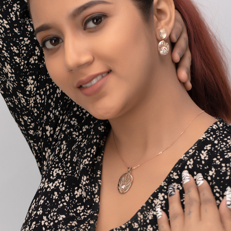 Woman styled in silver oval sun pendant, graceful accessory for parties and cultural functions.
