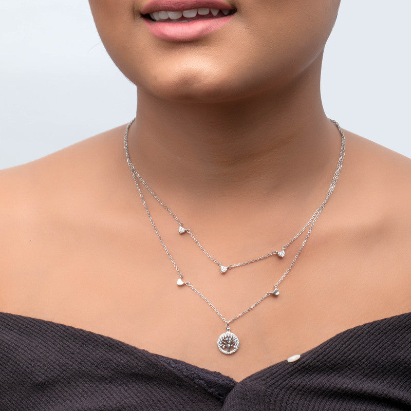 Woman wearing 925 silver tree of life layered necklace — elegant silver jewelry gift for festivals.