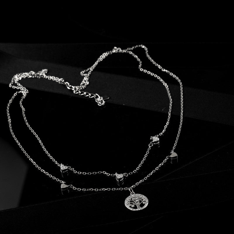 Close-up of silver tree of life pendant on layered chain — spiritual gift for Diwali, Eid, and Raksha Bandhan.