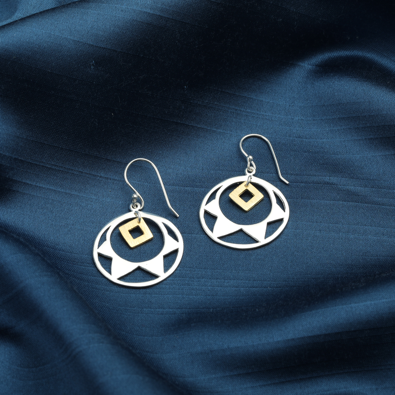 Close-up of 925 sterling silver glittering gem earrings
