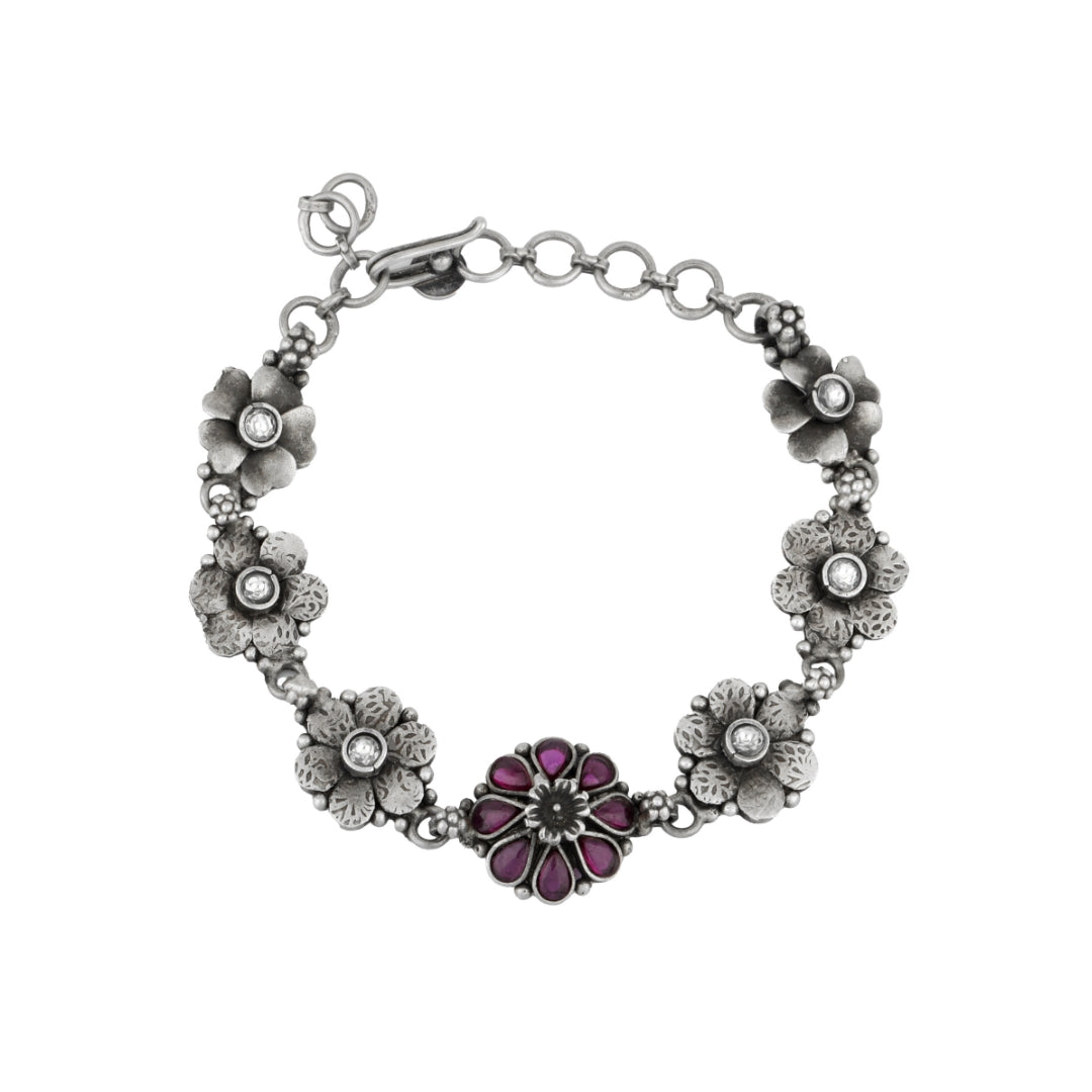 Antique silver pink flower bracelet with oxidised floral design.