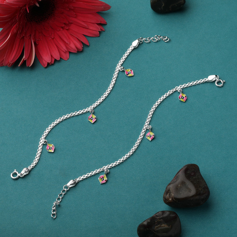 Hexagon baby anklet displayed with props – geometric silver accessory for kids