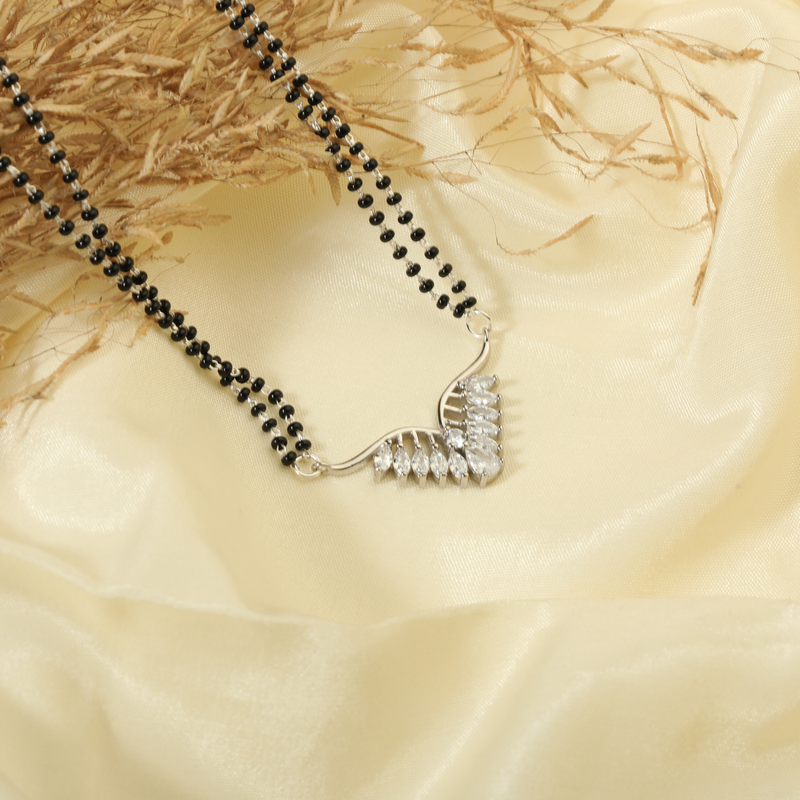 925 Silver Hitched & Happy Mangalsutra displayed on festive background – traditional silver jewellery with graceful style.