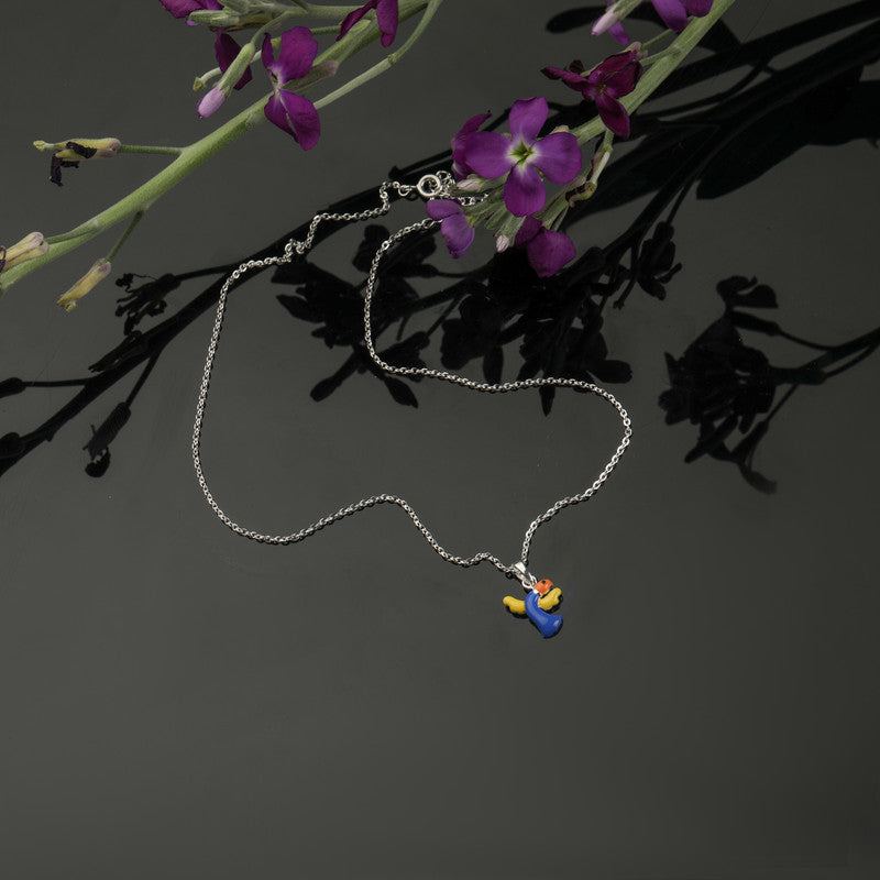 Kids Dolphin Pendant Necklace in 925 Silver styled on playful background