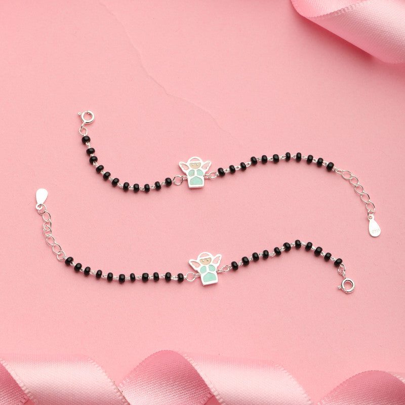 Kids Silver Fairy Nazariya Bracelet with Fairy Charm styled on fabric background