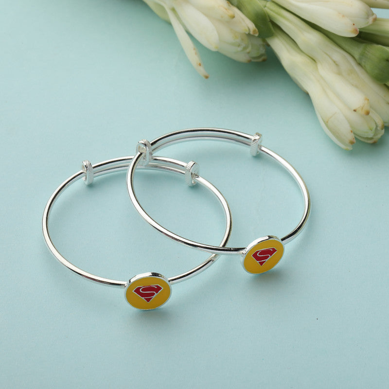 Kids Silver Superman Kada with Enamel Superman Logo styled on fabric background