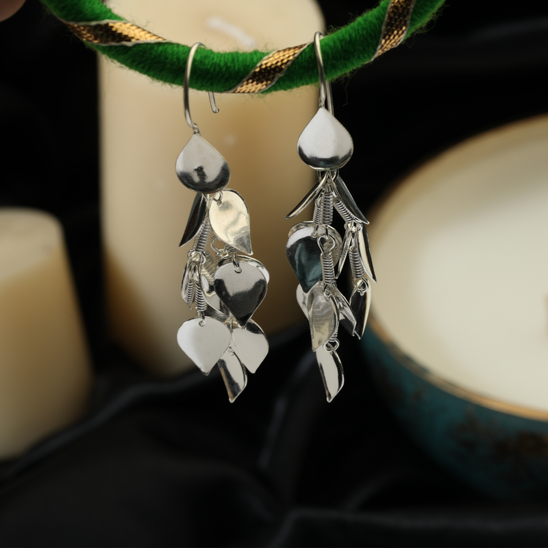 925 Silver Oceanic Hearts Earrings displayed as prop image on festive background – stylish silver earrings with fine detailing.