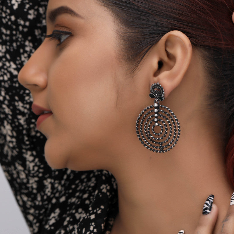 Oxidized Silver Floral Tassel Earrings on Model – Elegant Silver Earrings for Navratri, Diwali and Wedding Outfit Styling