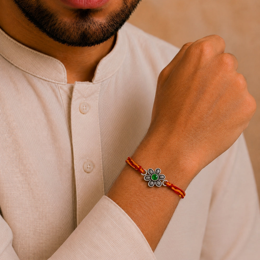 Brother wearing Oxidized Silver Flower Rakhi by Silviya – stylish floral rakhi for Raksha Bandhan.