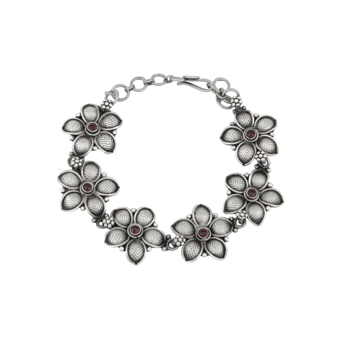 Oxidized silver Pankhudi bracelet with floral-inspired design.