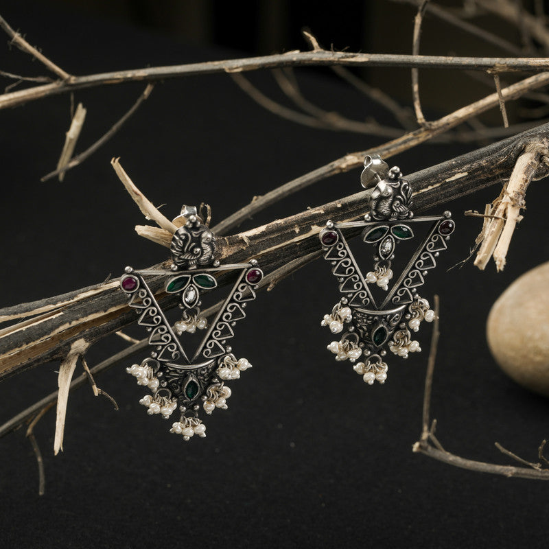 Designer Oxidized Silver Peacock Earrings with Ethnic Backdrop – Stylish Silver Jewellery for Festive Celebrations