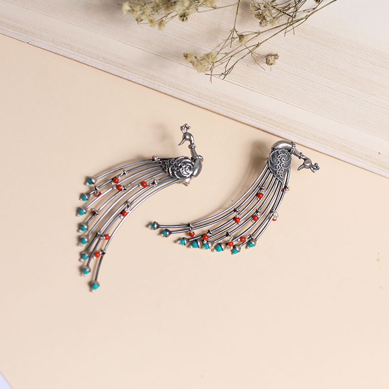 Designer Oxidized Silver Peacock Feather Earrings with Ethnic Backdrop – Stylish Silver Jewellery for Festivals, Weddings and Celebrations