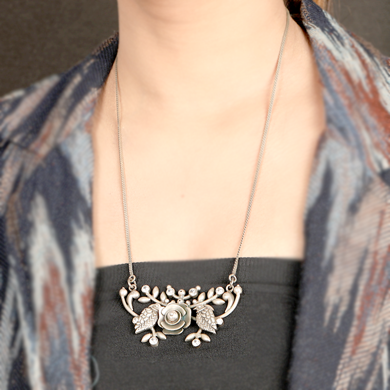 Bird and flower oxidised silver necklace styled with saree for Navratri, Diwali, and wedding looks