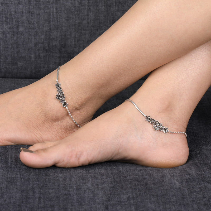 Oxidized silver charm anklet styled on foot – traditional ethnic jewelry by Silviya.