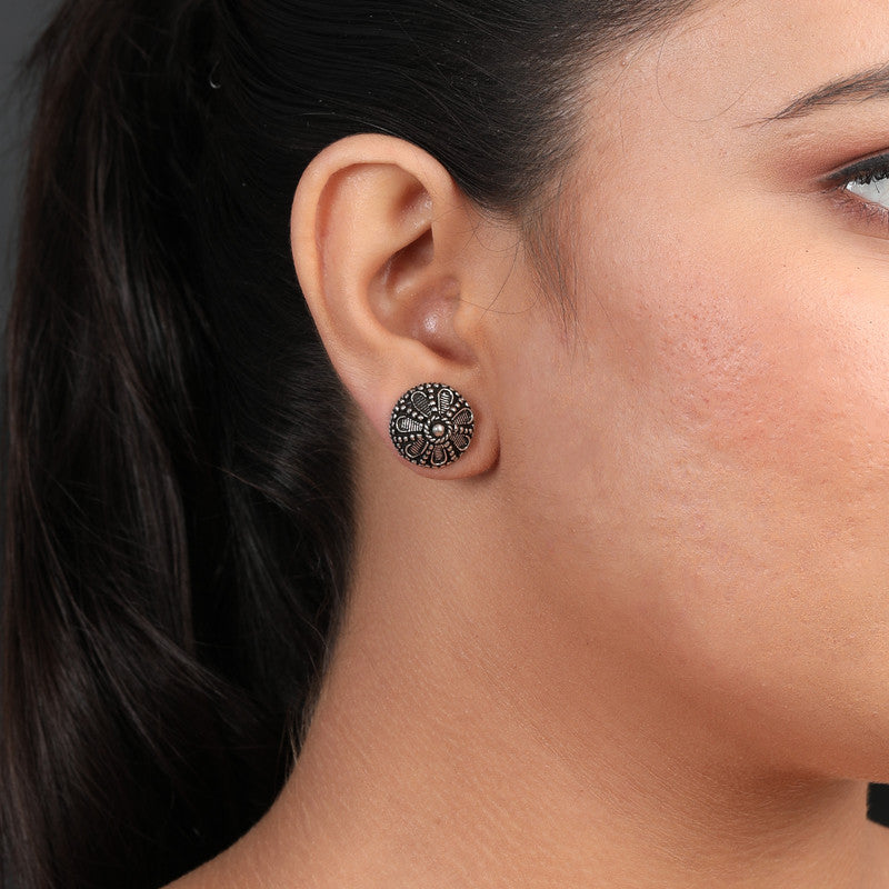 Elegant oxidized silver flower stud earrings on model ethnic jewelry for weddings and cultural celebrations